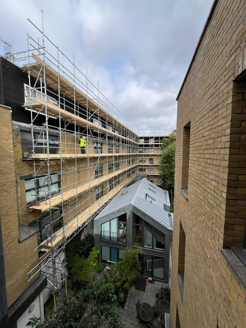 Courtyard scaffolding with operatives — Elm Site Services