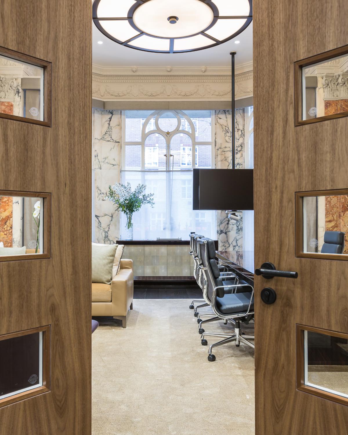 Bay-window office seen through timber doors — Elm Site Services