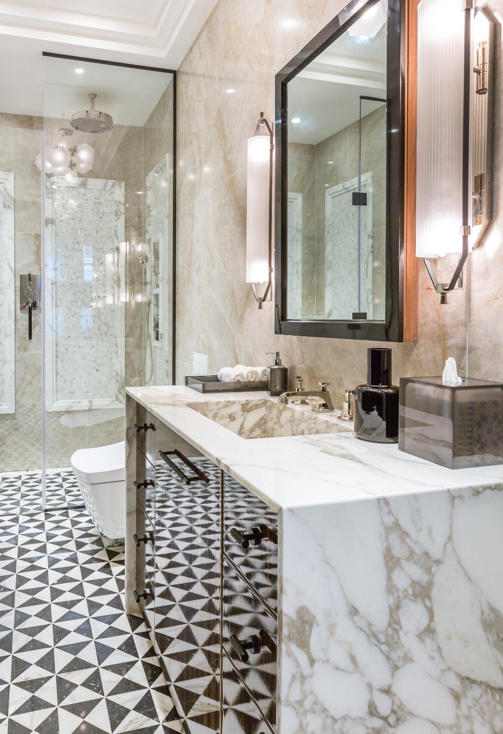 Marble washroom with geometric floor — Elm Site Services