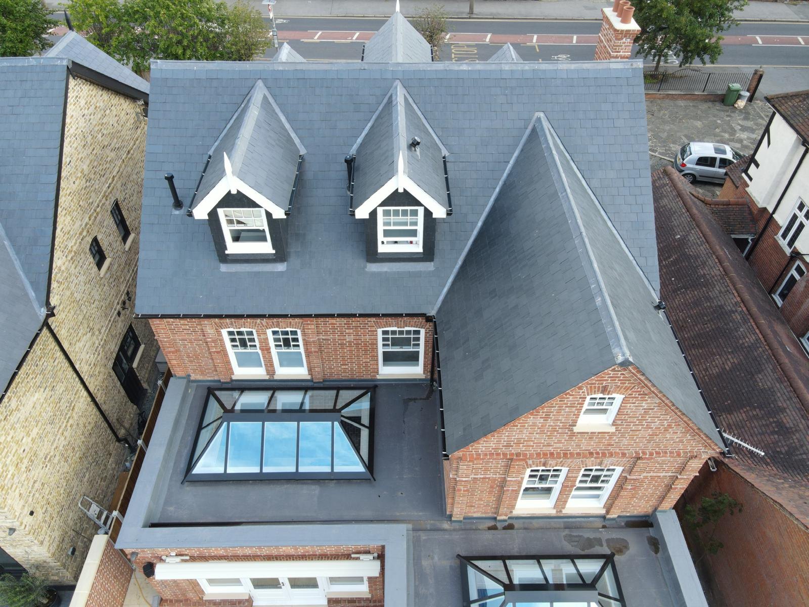 Completed slate roof with dormers and a roof lantern — Elm Site Services