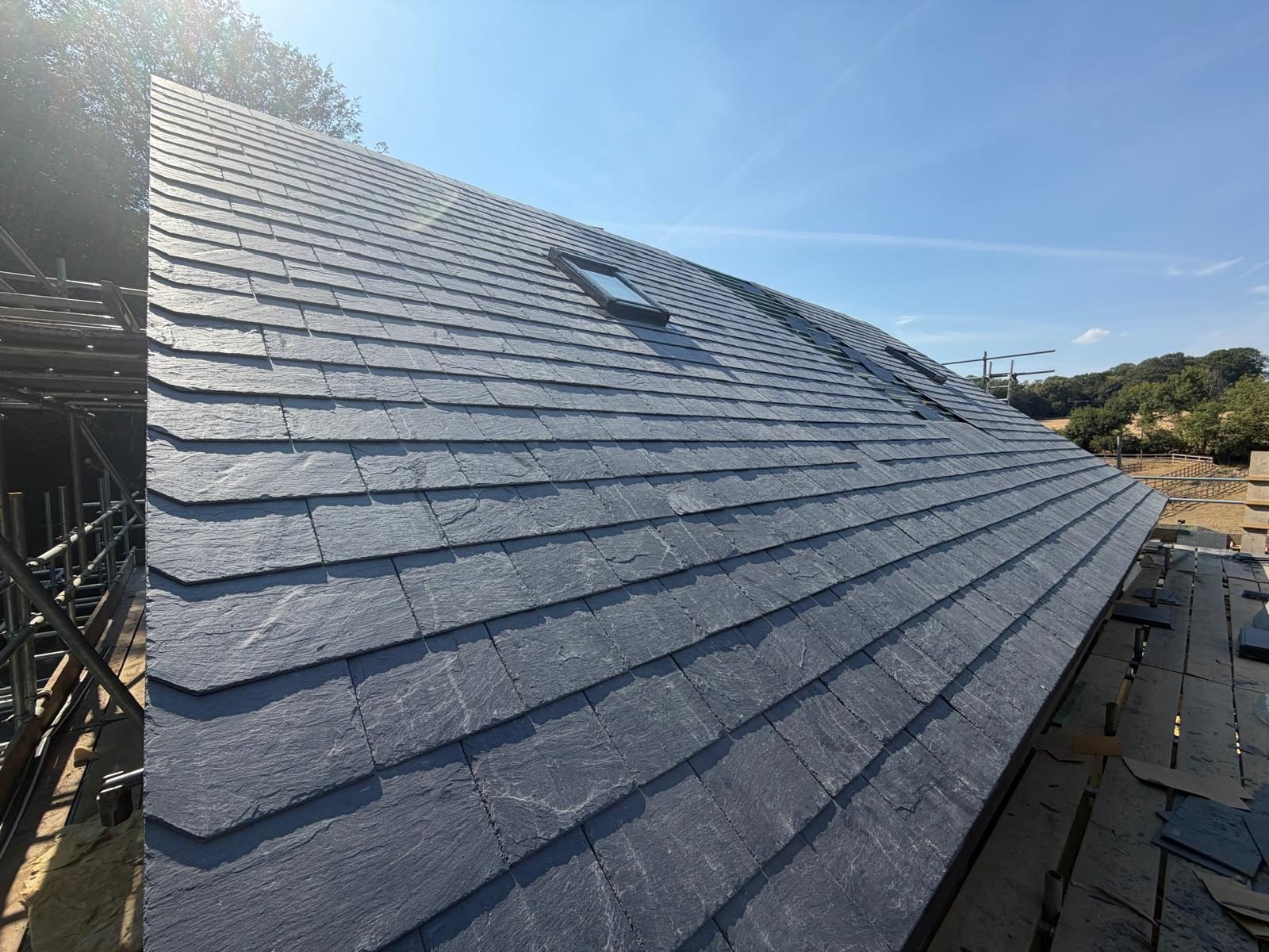Long slate roof slope with a rooflight — Elm Site Services