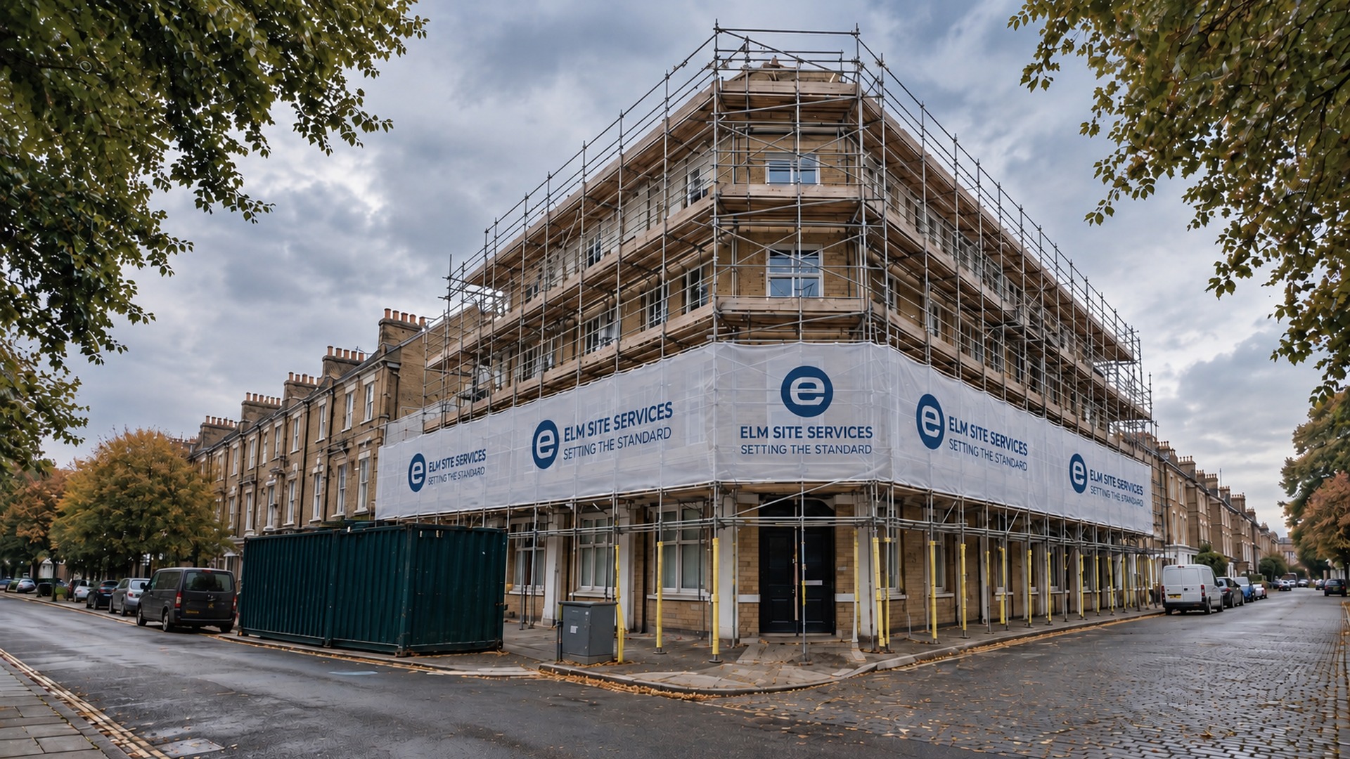 Corner brick terrace in scaffold, with an Elm Site Services wrap around the lower floors